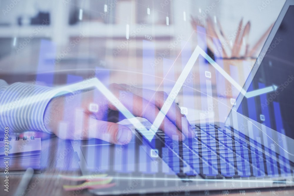 Double exposure of stock market graph with man working on laptop on background. Concept of financial analysis. Double exposure of stock market graph with man working on laptop on background. Concept of financial analysis.