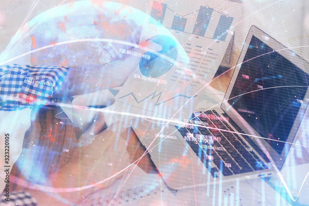 Double exposure of forex chart with man working on computer on background. Concept of market analysis. Double exposure of forex chart with man working on computer on background. Concept of market analysis.