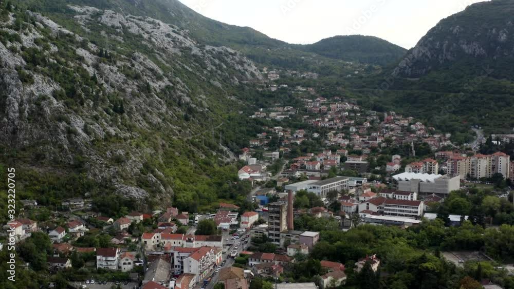Newer Part of Kotor with Mountains and Forrest in Background (Montenegro, aerial) Newer Part of Kotor with Mountains and Forrest in Background (Montenegro, aerial)