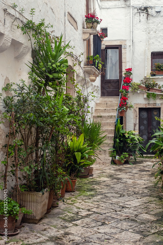 Walking charming white streets of Locorotondo in Puglia, Italy