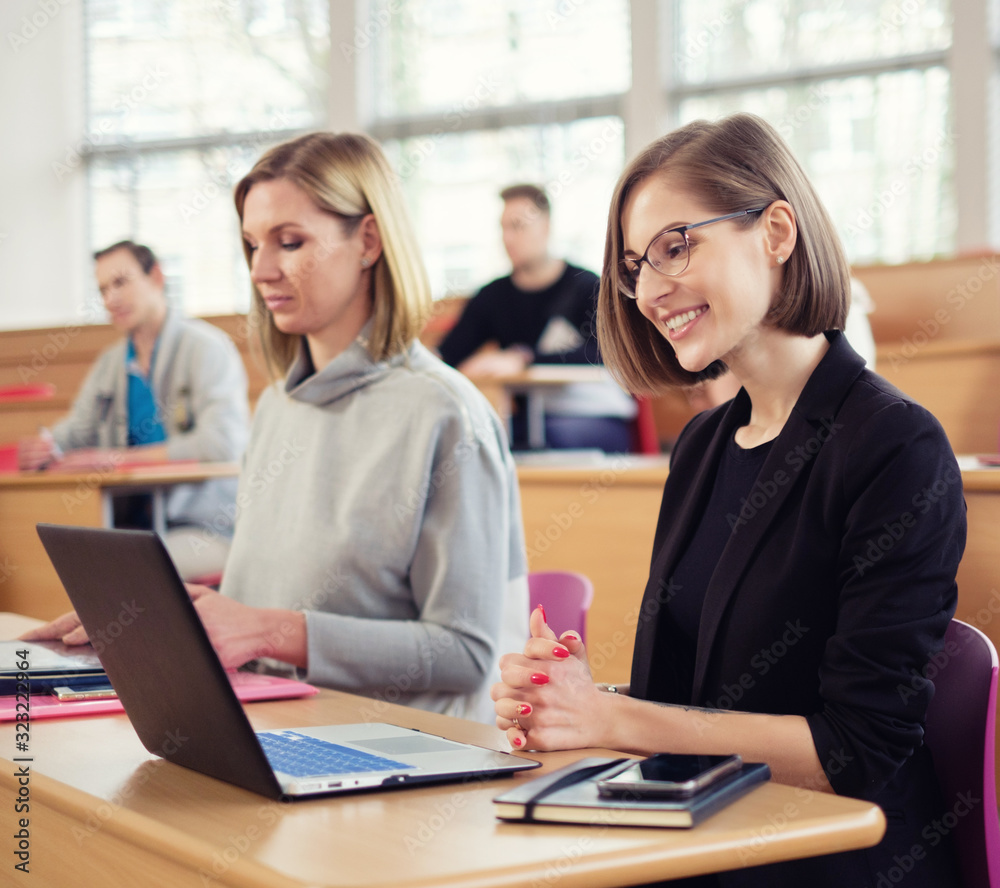 Multinational group of students in an auditorium Multinational group of students in an auditorium