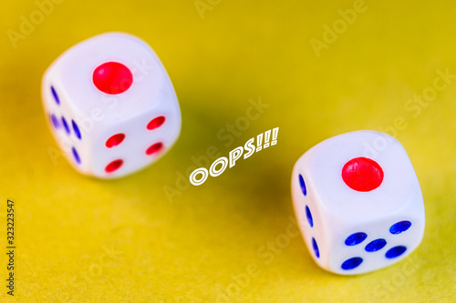 The image of dices on the colour background with an inscription 