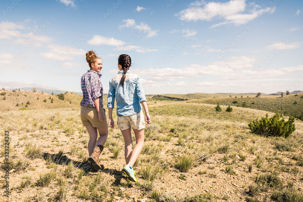 Two best girlfriends hanging out in the foothills having fun. Bridger, Montana, USA Two best girlfriends hanging out in the foothills having fun. Bridger, Montana, USA