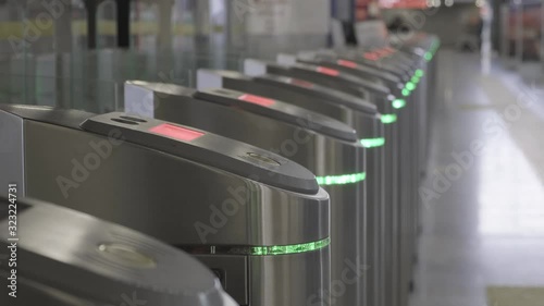Validator. Checkpoint. Red blinking lights. Ticket control. The entrance and exit to the subway. 