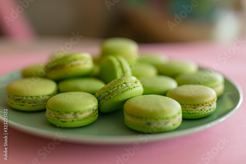 Green sweet macaroons on the plate