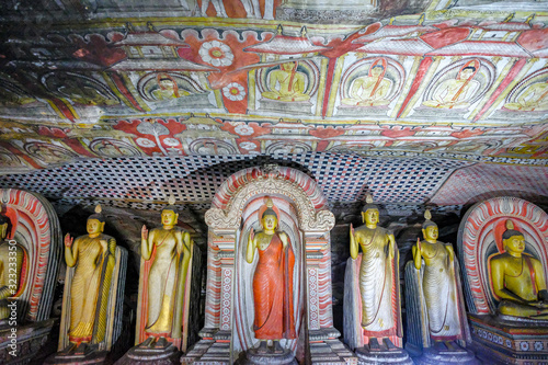 Buddha statue inside Dambulla cave temple on February 8, 2020 in Dambulla, Sri Lanka. Cave II Maharaja Viharaya. Major attractions are spread over 5 caves, which contain statues and paintings. photo