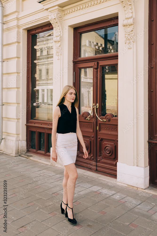 Young beautiful woman walking on the street Young beautiful woman walking on the street