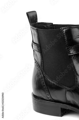 Close-up of part of black shoe heel