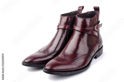 Pair of burgundy high-heeled shoes on white