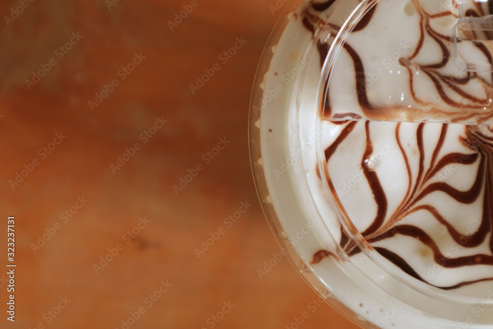 Fototapeta premium Cappuccino coffee art patterns and wooden floors