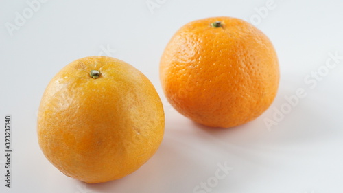 Tangerines in the skin and peeled