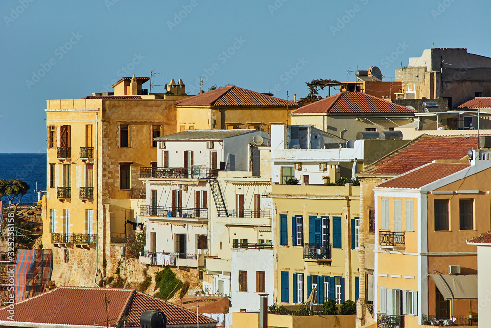 Facade building with windows and balconies in Chania on the island of Crete.