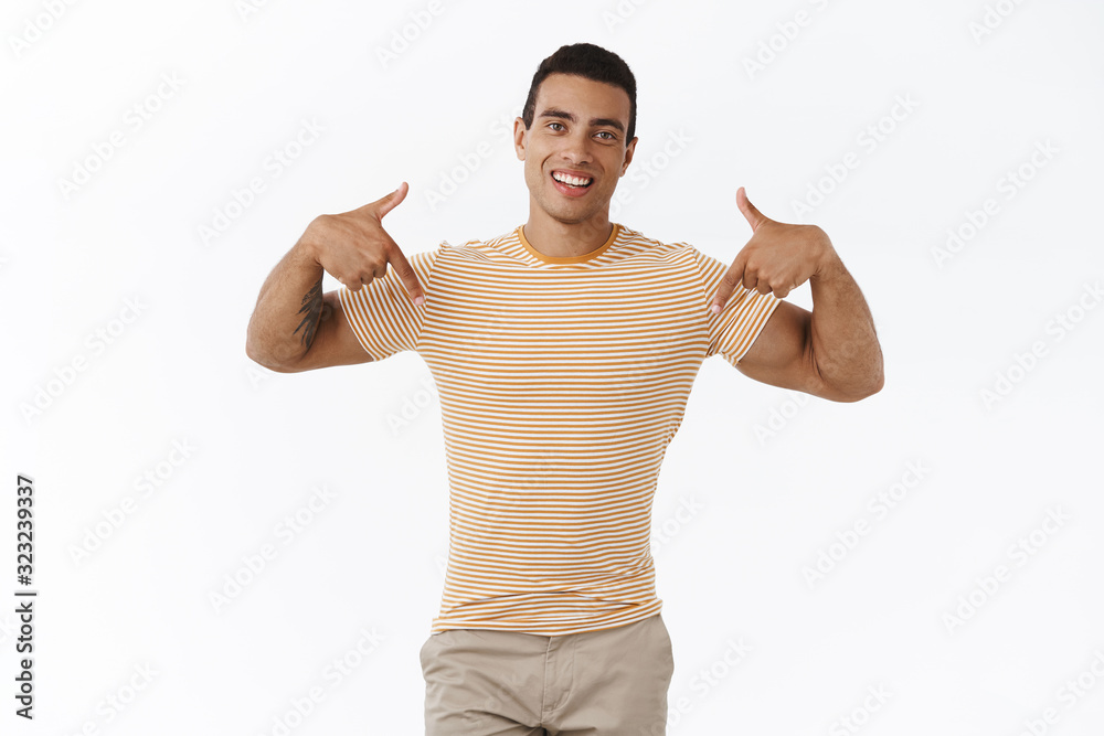 Proud, handsome and confident young hispanic guy showing girlfriend her birthday present, pointing at bottom, presenting advertisement, recommend click link, smiling pleased, white background Proud, handsome and confident young hispanic guy showing girlfriend her birthday present, pointing at bottom, presenting advertisement, recommend click link, smiling pleased, white background