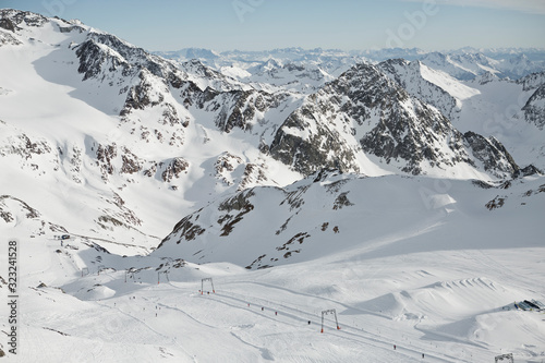 Austrian Mountains in the Alps of Tyrol. Alpine Winter landscape and mountain panorama in Europe. Glacier Stubaier Gletscher Skiing area near Innsbruck. Lift line