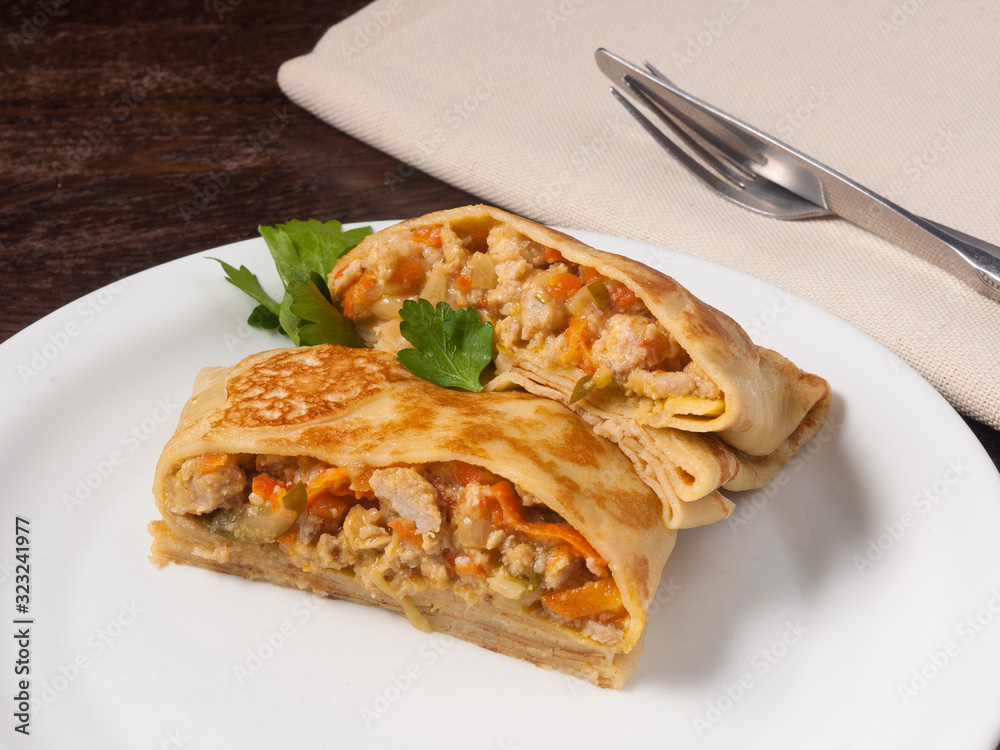 hearty pancake with chicken pickles onions and carrots