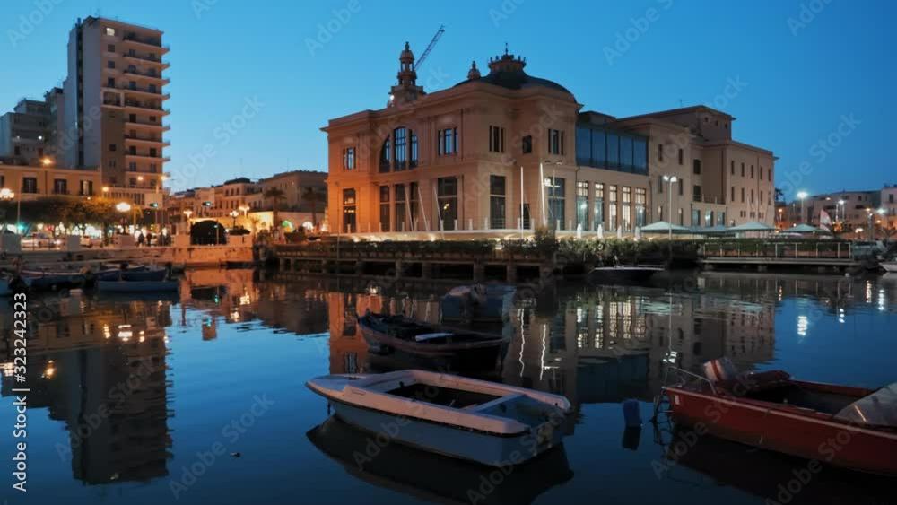 Old fishing boats in Bari at sunset, Italy