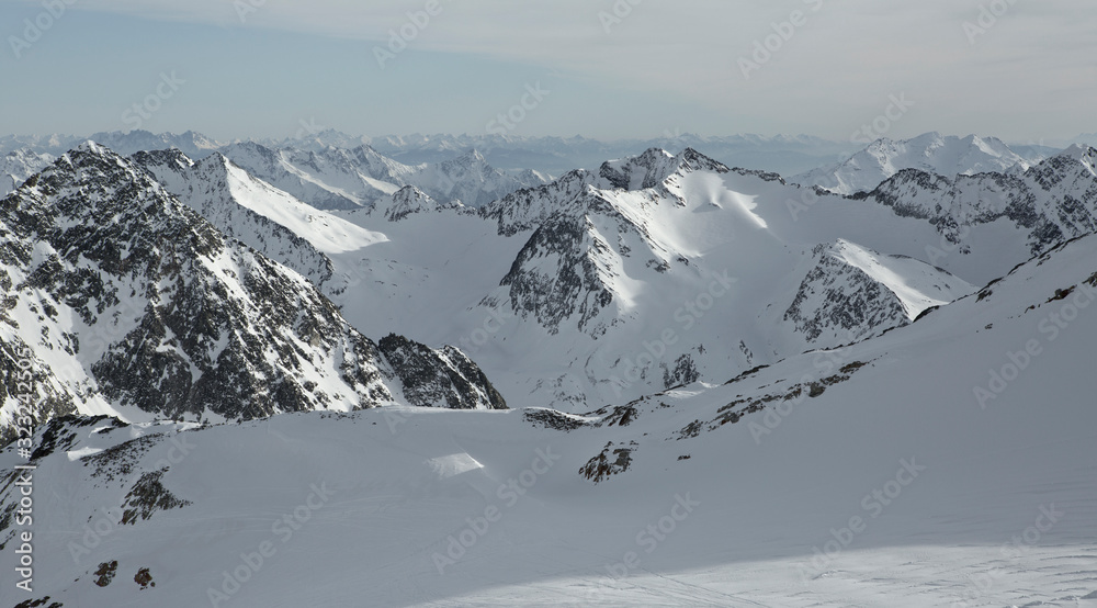 Obraz premium Austrian Mountains in the Alps of Tyrol. Alpine Winter landscape and mountain panorama in Europe. Glacier Stubaier Gletscher Skiing area near Innsbruck. Beautiful scenery