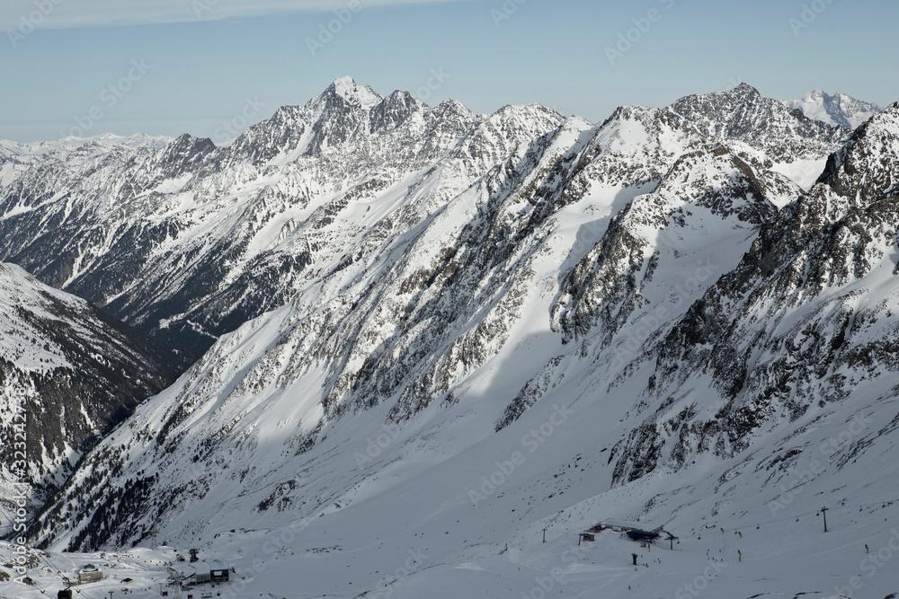 Fototapeta premium Mountains in Austria in the Alps of Tyrol. Alpine winter landscape in Europe. Glacier Stubaier Gletscher. Beautiful valley