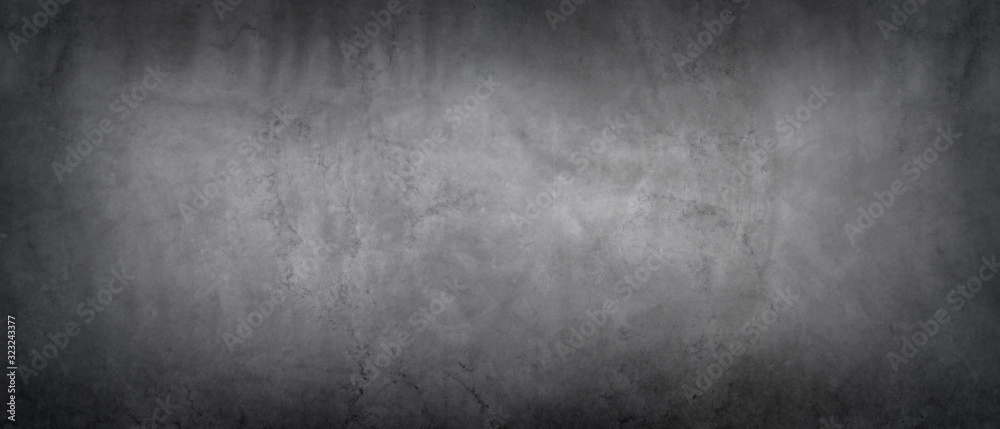 Dark gray wall with concrete texture and vignette as a background Dark gray wall with concrete texture and vignette as a background