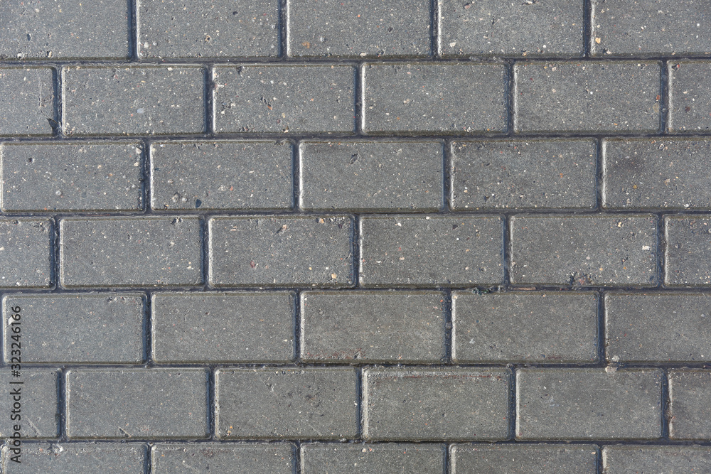 pattern of wet stone bricks on the sidewalk pattern of wet stone bricks on the sidewalk