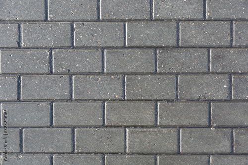 pattern of wet stone bricks on the sidewalk