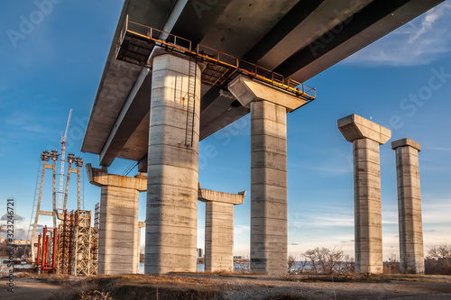 Powerful bridge piers across the river © Vitaliy