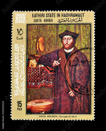 Cancelled postage stamp printed by Kathiri State in Hadhramaut, South Arabia, that shows portrait of Georges De Selve, by Hans Holbein, circa 1972. photo