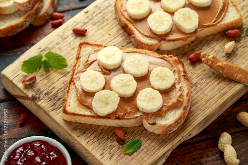 Peanut Butter and banana Sandwich on wooden board. morning breakfast