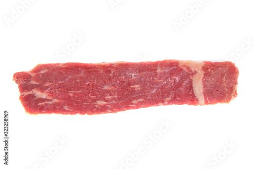 piece of raw beef meat on a white background