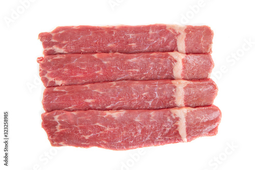 sliced raw beef meat on a white background