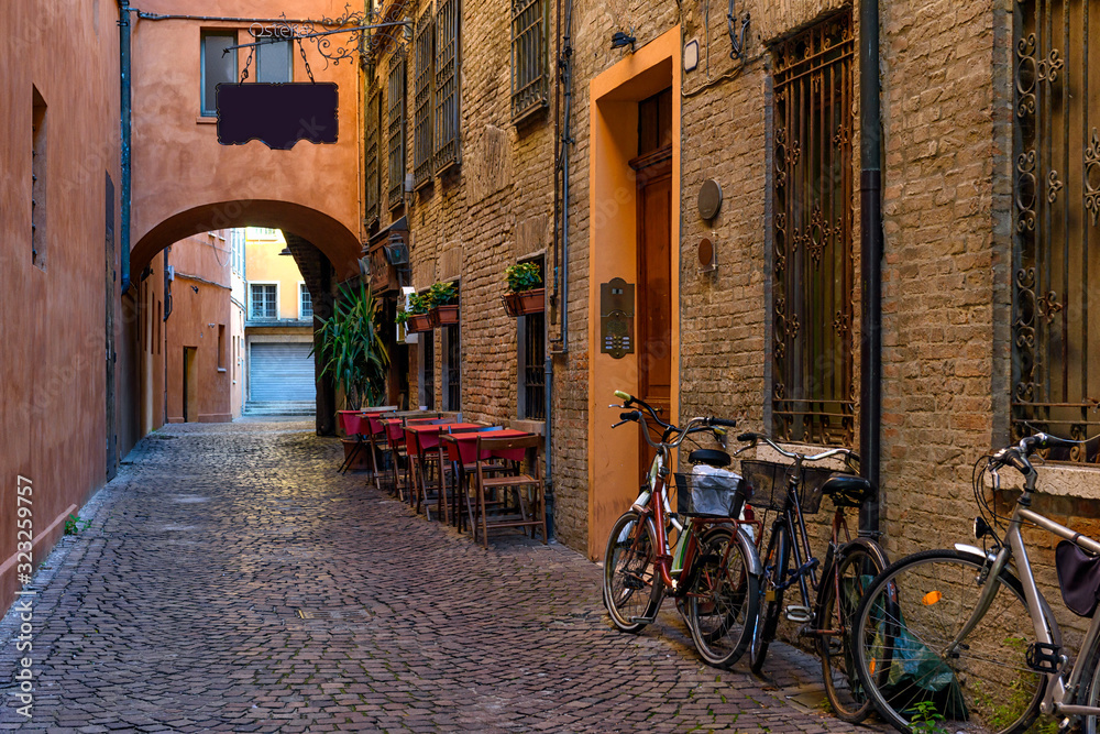 Cozy narrow street in Ferrara, Emilia-Romagna, Italy. Ferrara is capital of the Province of Ferrara