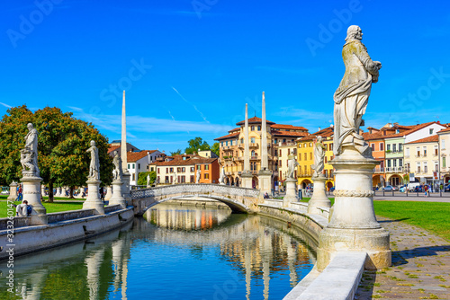 Fototapeta Naklejka Na Ścianę i Meble -  View of canal with statues on square Prato della Valle in Padova (Padua), Veneto, Italy