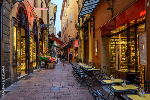 Old narrow street in Bologna, Emilia Romagna, Italy. Architecture and landmark of Bologna. Cozy cityscape of Bologna.