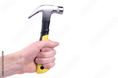 Hand holds hammer isolated on white background © Ivan