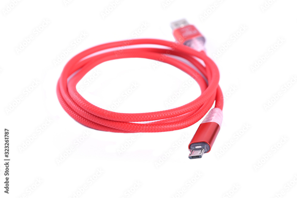 Red USB cable for smartphone charge isolated on white background. Red USB cable for smartphone charge isolated on white background.