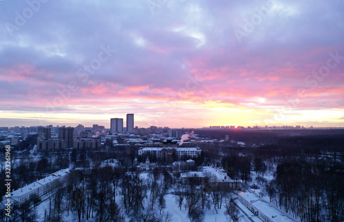 cityscape shot from a quadrocopter in winter at sunrise