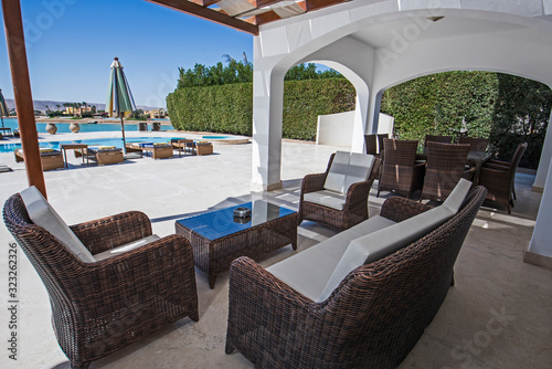 Swimming pool and outdoor seating area at a luxury tropical holiday villa