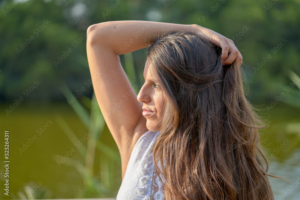 A young pretty pregnant woman on the beach A young pretty pregnant woman on the beach