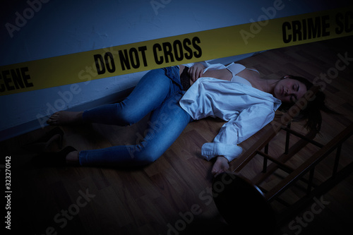 crime scene - woman lying dead on the floor photo