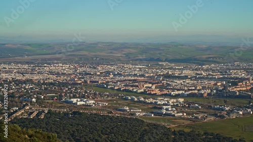 Gimbal shot of panoramic view in Las Ermitas Cordoba. Countryside view, mountains, hills and houses shot from the top during daylight, Spain photo