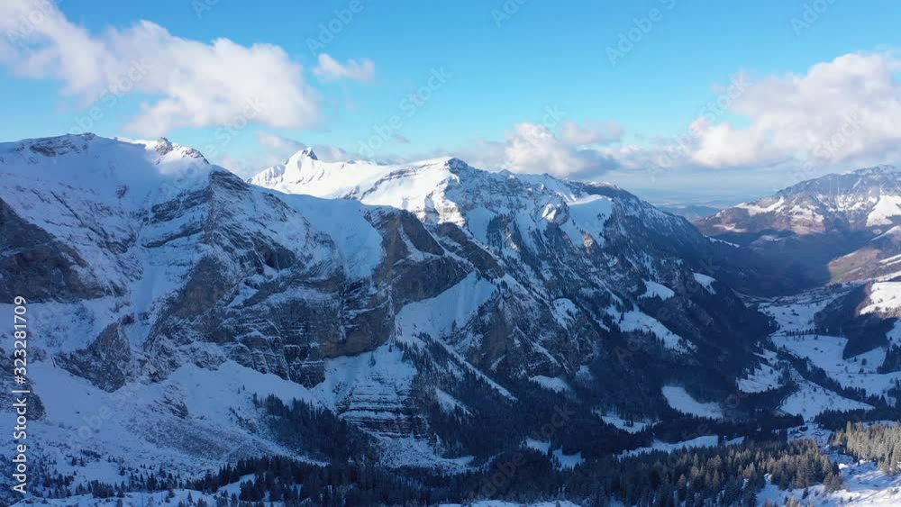 Beautiful sunny winter´s day in the alps with snow capped mountains - aerial drone footage - aerial photography Beautiful sunny winter´s day in the alps with snow capped mountains - aerial drone footage - aerial photography