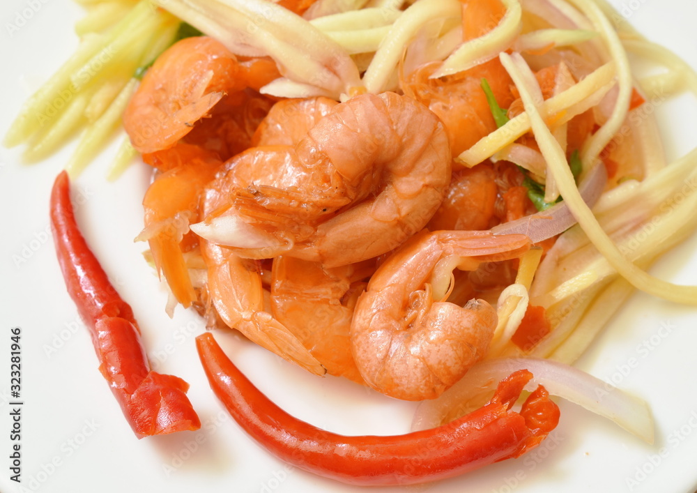 spicy dried shrimp with slice mango fruit salad on plate spicy dried shrimp with slice mango fruit salad on plate