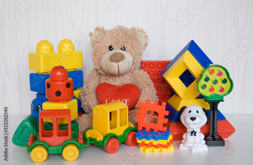 plush bear with different plastic toys