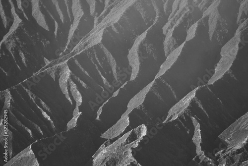 Nature landscape of Surface Wave of Volcanic soil texture background at slope of bromo mountain at Bromo tengger semeru national park indonesia - Backdrop Black and white patterns photo