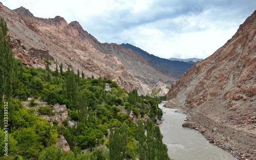 Indus river with bare mountains behind next to Leh, Ladakh