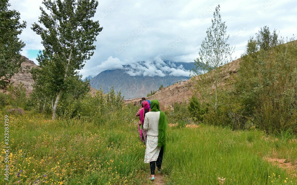 Muslim girls hike through the Himalayan mountains in Kashmir Muslim girls hike through the Himalayan mountains in Kashmir