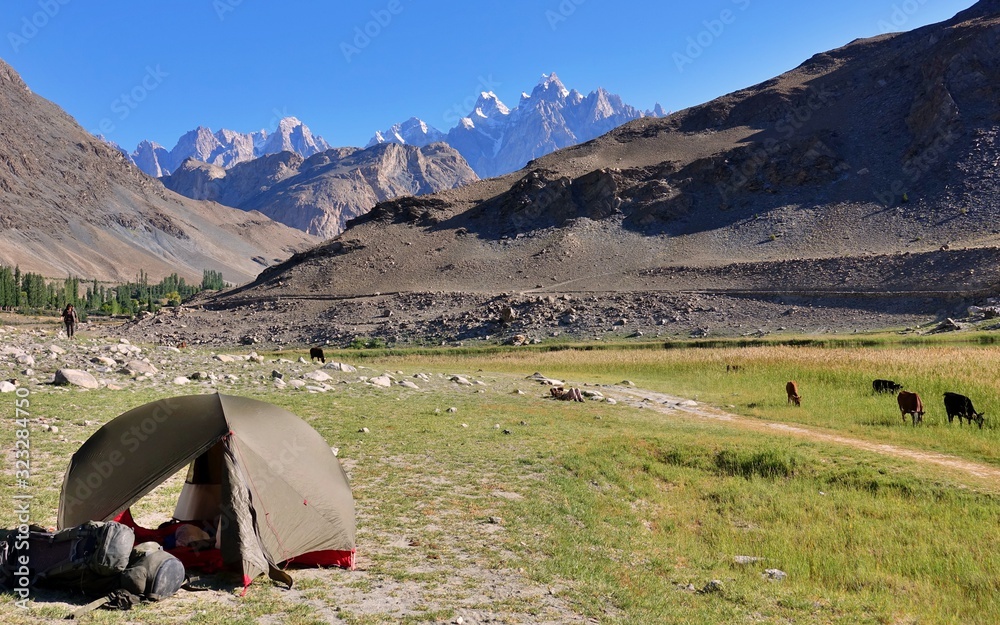 Camping with green tent in Hunza - View over white peaks of Pakistan