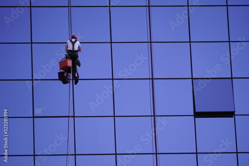 Wallpaper Mural an industrial climbing, cleaning of Windows, glass elements of building. maintenance of skyscrapers. hard work Torontodigital.ca