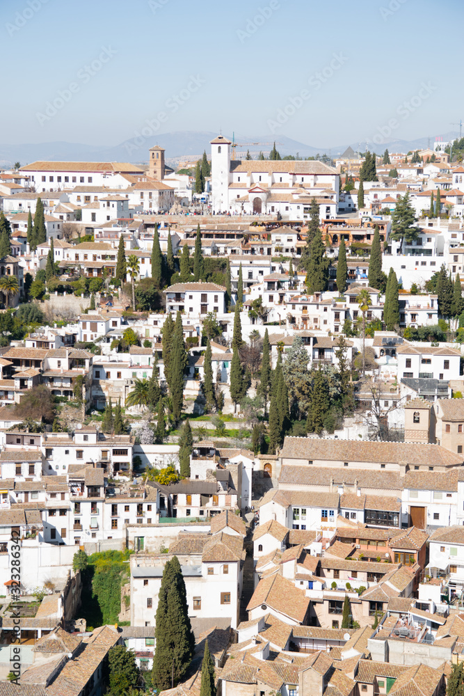 View of a Mediterranean town with all the white houses and buildings in Granada, southern Spain,