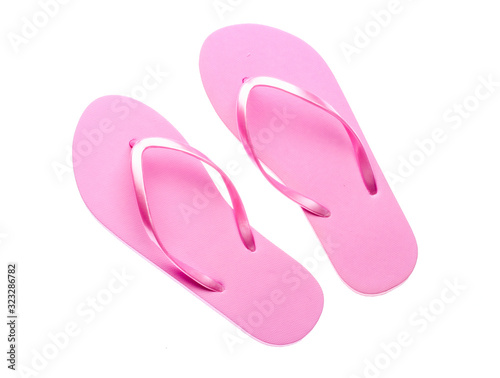 Pink plastic flip-flops isolated on a white background.